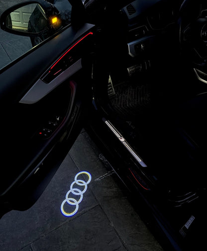 2x Projecteurs de porte Led compatible pour AUDI (4 anneaux) (PLUG&PLAY)